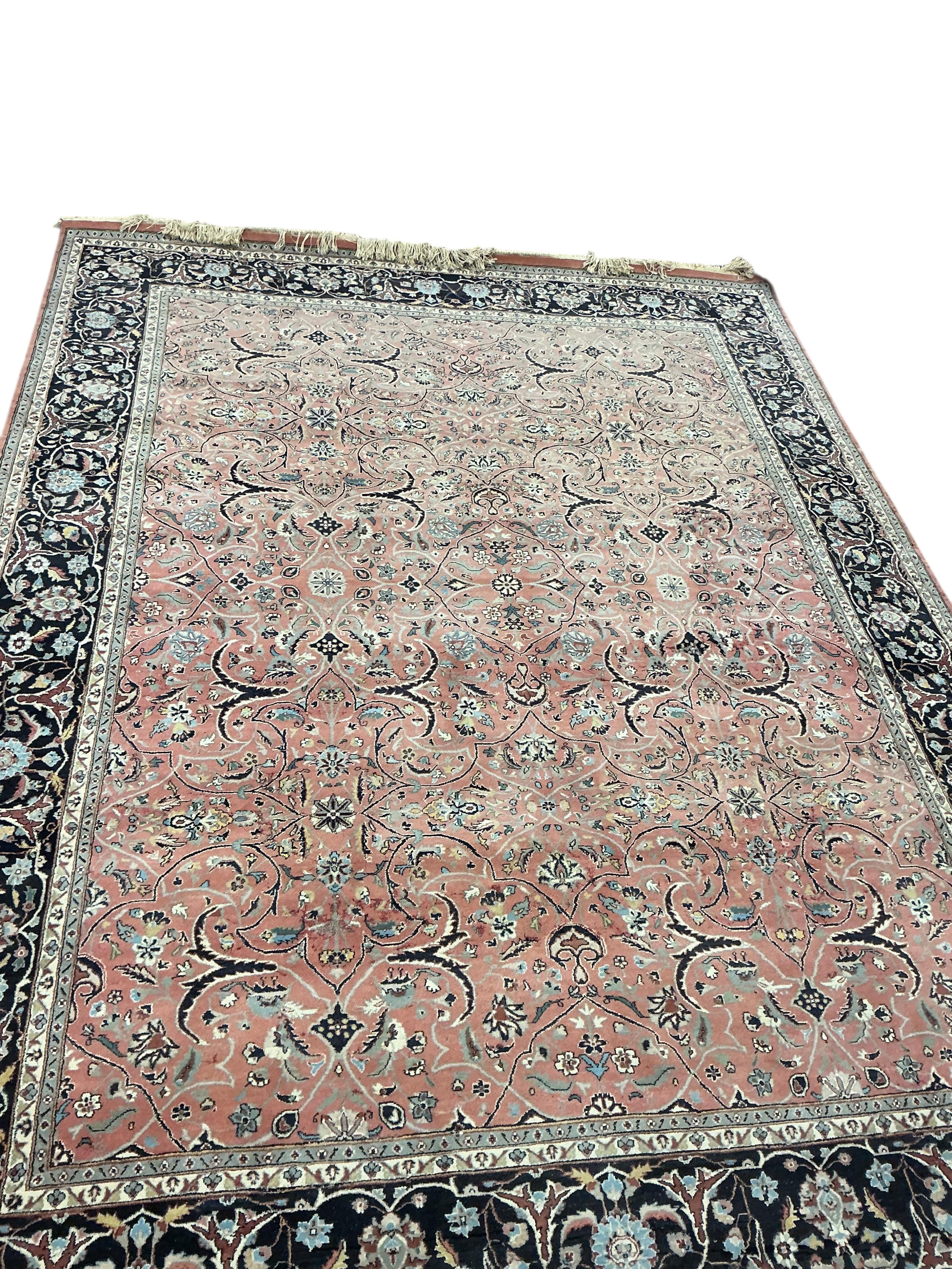A Tabriz peach ground carpet, 330 x 248cm